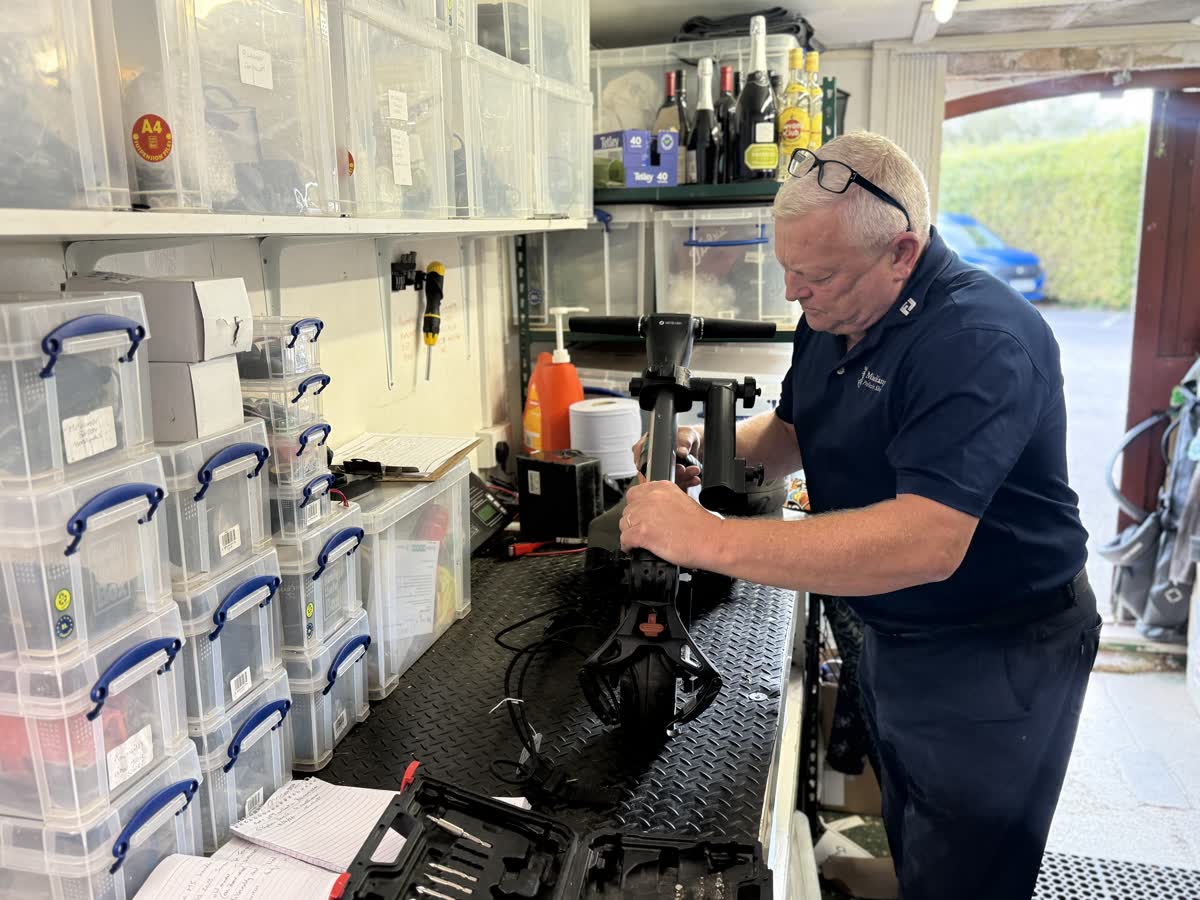 Fraser Hughes working at the workshop bench