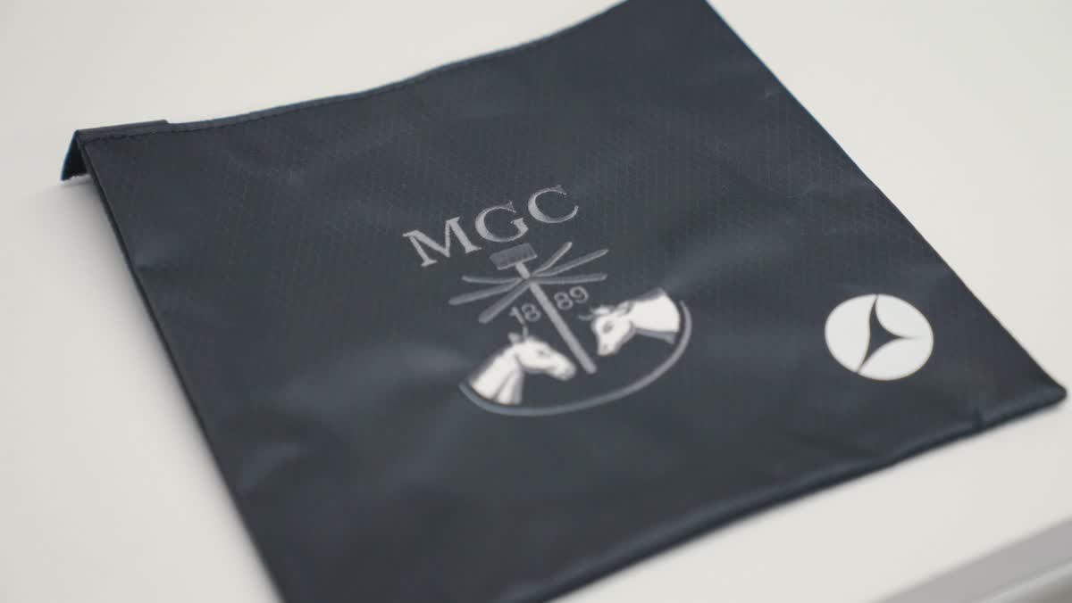 Finished bag with embroidered crest