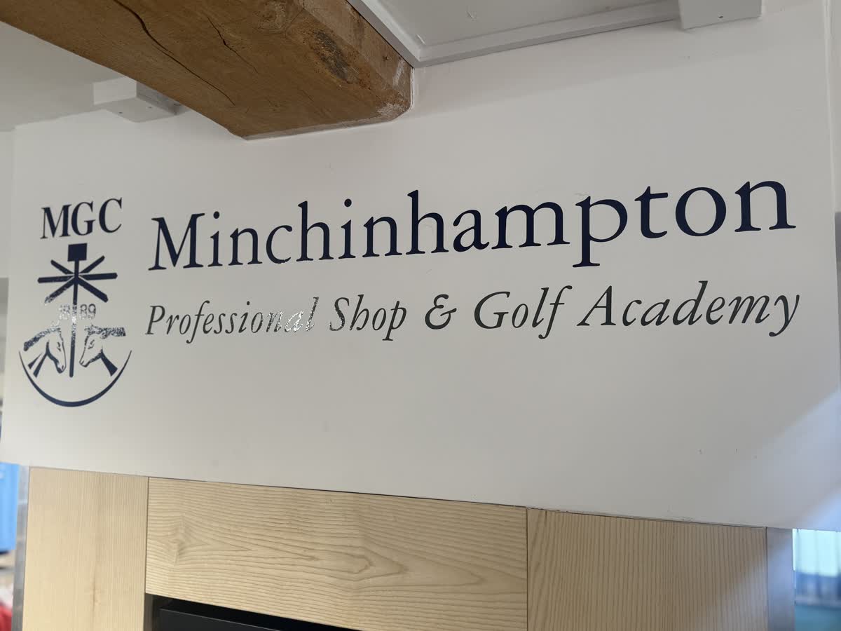 Sign reading MGC Minchinhampton Professional Shop and Golf Academy