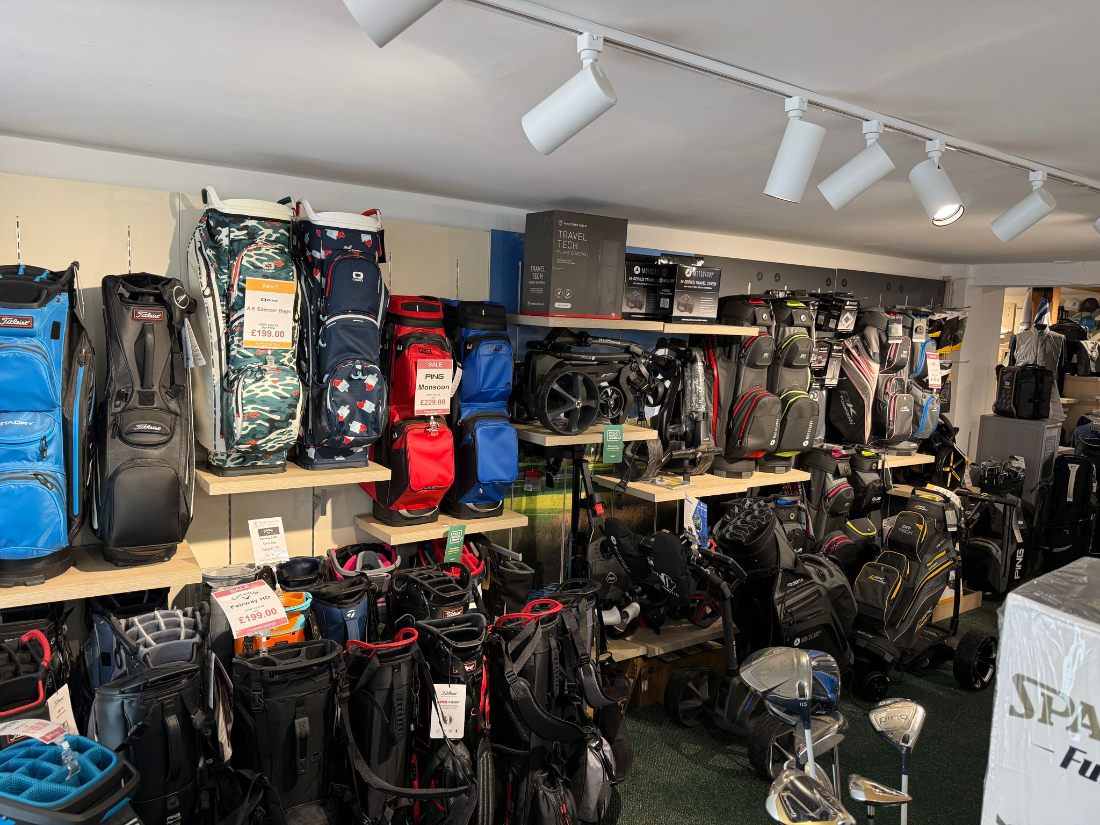 Golf bags and trolleys on the shop floor
