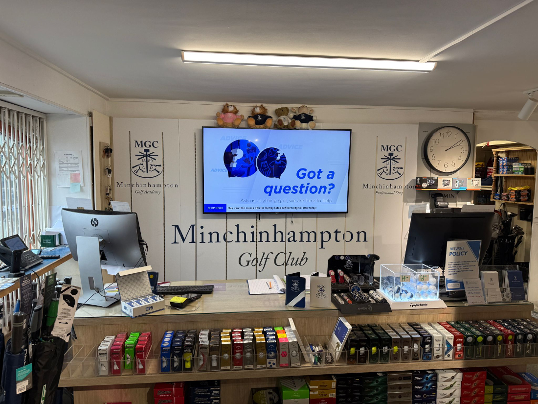 The shop counter with the Minchinhampton Golf Club crest behind