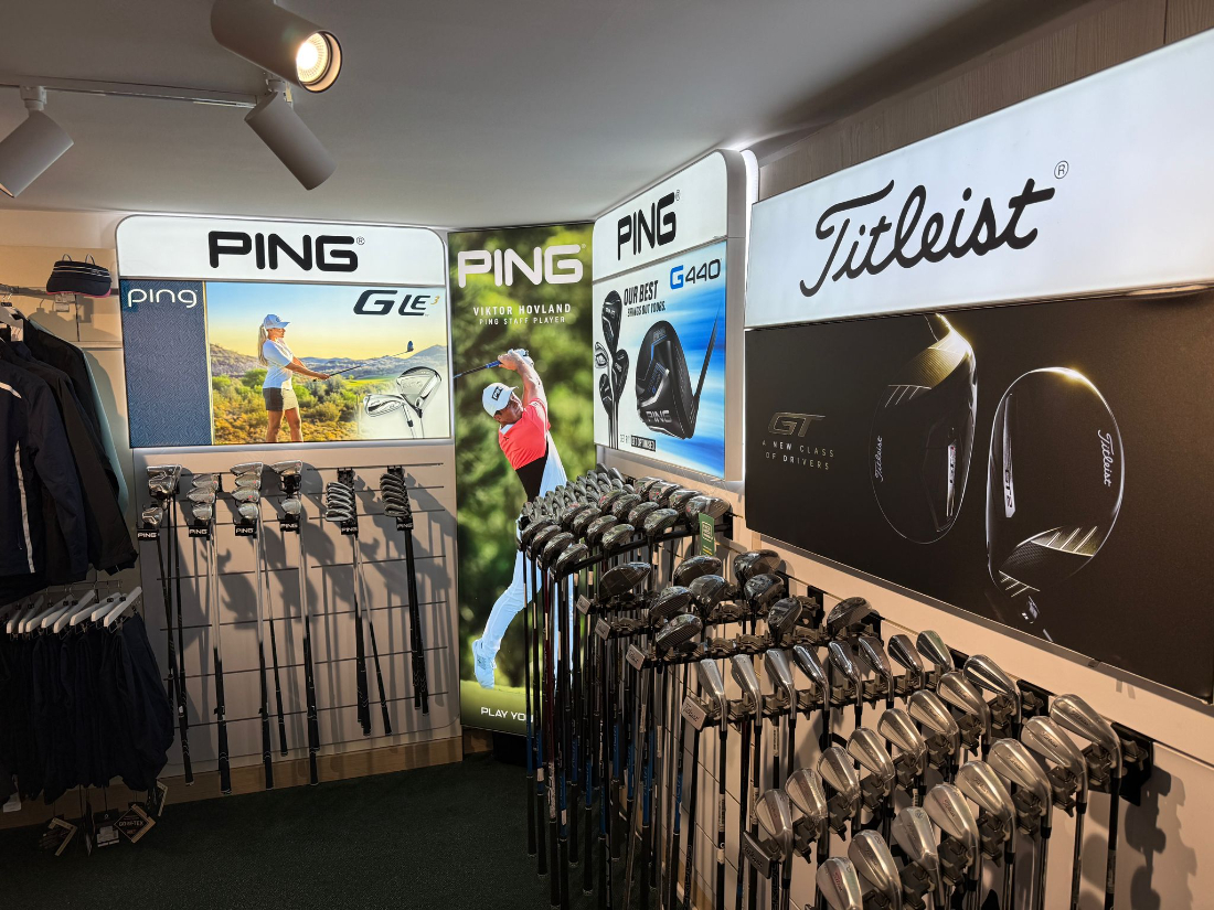 Ping and Titleist iron displays and club racks in the professional shop